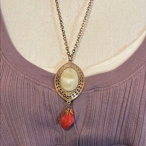 Gold tone Pendant with cream center bead and quartz stone dangle